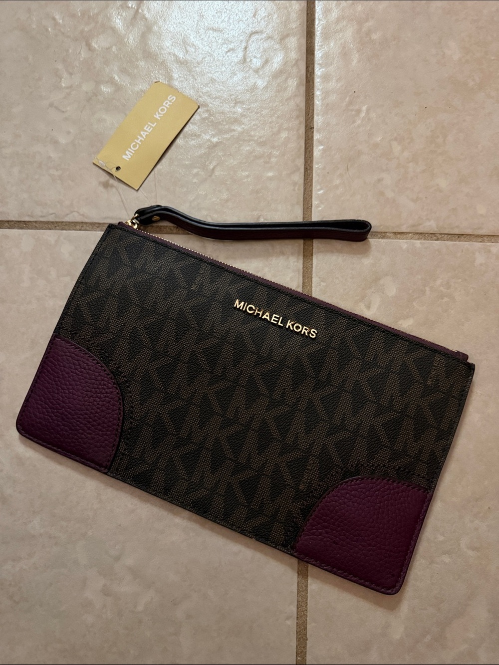 Michael Kors Monogram Wristlet in Brown and Dark Plum